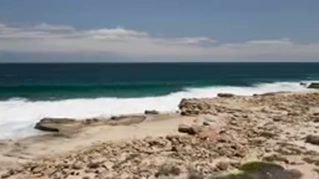 LAGUNA BEACH EAST CAPE BCS MEXICO-2023: Rocky Beach With Scattered Rocks and Waves