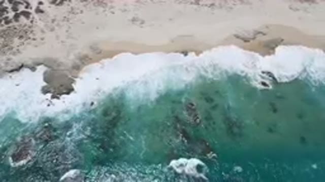 LAGUNA BEACH EAST CAPE BCS MEXICO-2023: Aerial Beach With A Body Of Water And