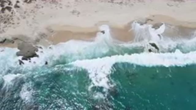LAGUNA BEACH EAST CAPE BCS MEXICO-2023: Aerial Beach With A Body Of Water And
