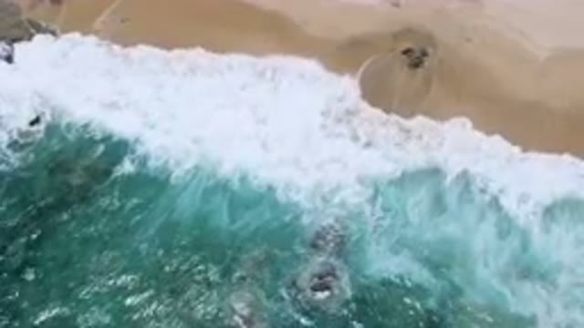 LAGUNA BEACH EAST CAPE BCS MEXICO-2023: Aerial Beach With A Body Of Water And A