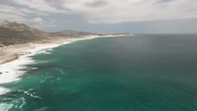 LAGUNA BEACH EAST CAPE BCS MEXICO-2023: Beach With A Body Of Water And A
