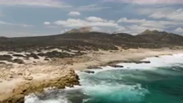 LAGUNA BEACH EAST CAPE BCS MEXICO-2023: Large Body Of Water That Is Next To A Rocky Shore