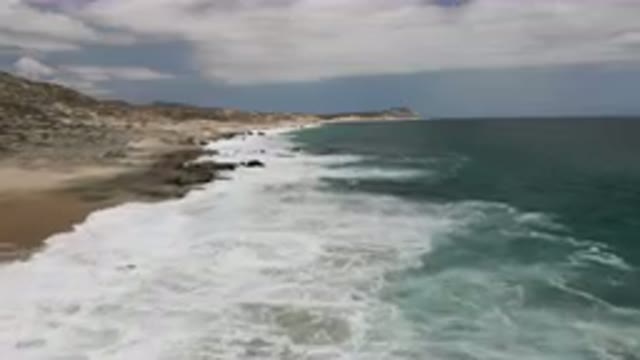 LAGUNA BEACH EAST CAPE BCS MEXICO-2023: Beach With Waves Crashing On The Rocks