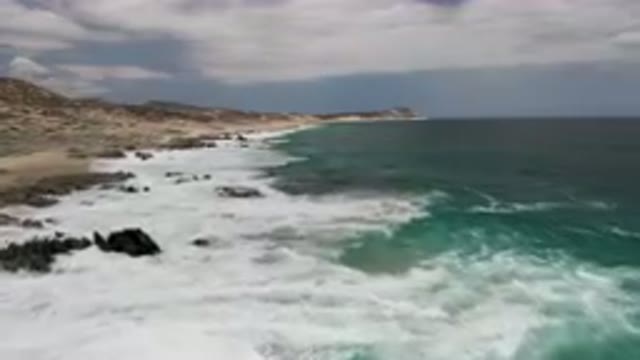 LAGUNA BEACH EAST CAPE BCS MEXICO-2023: Beach With Waves Crashing On The Rocks