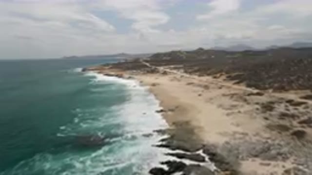 LAGUNA BEACH EAST CAPE BCS MEXICO-2023: Beach With A Rocky Shoreline And A Few Waves