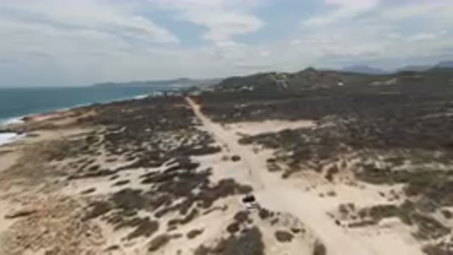 LAGUNA BEACH EAST CAPE BCS MEXICO-2023: Vehicle Driving On A Dirt Road Near The Shore
