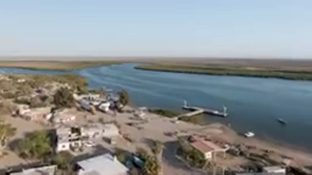 ALDOFO LOPEZ MATEOS BCS MEXICO-2023: Aerial View of Small Town With River Running