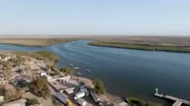 ALDOFO LOPEZ MATEOS BCS MEXICO-2023: Aerial River And A City With A Boat Dock