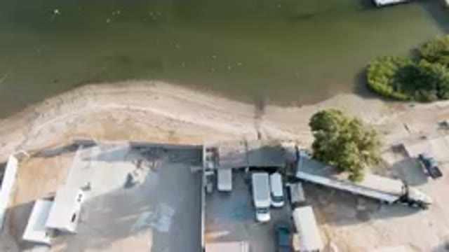 ALDOFO LOPEZ MATEOS BCS MEXICO-2023: Aerial Beach With Trucks Parked On The Shore