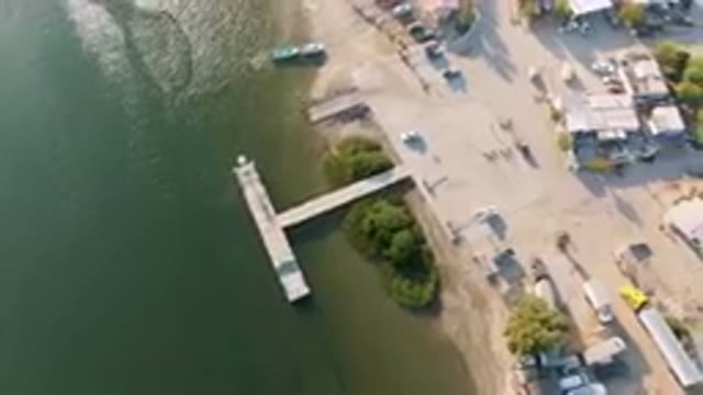 ALDOFO LOPEZ MATEOS BCS MEXICO-2023: Aerial View of Small Town With Dock and Boat