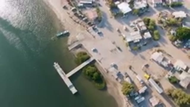 ALDOFO LOPEZ MATEOS BCS MEXICO-2023: Aerial View of Small Town With Dock and Boat