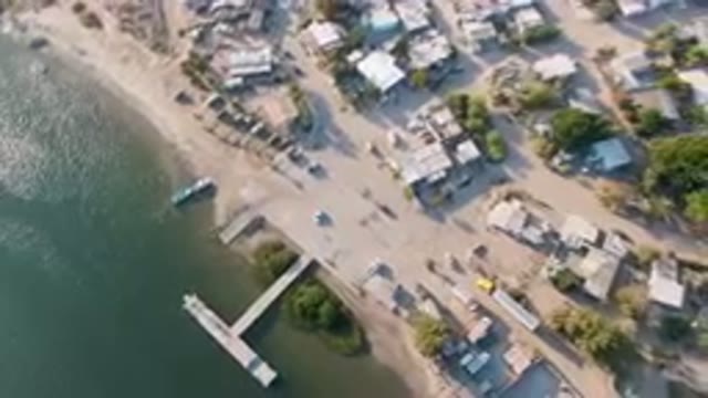 ALDOFO LOPEZ MATEOS BCS MEXICO-2023: Aerial View of Small Town With Dock and Boat