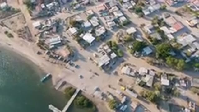 ALDOFO LOPEZ MATEOS BCS MEXICO-2023: Aerial View of Small Town With Beach and Body of Water