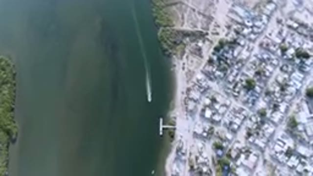 ALDOFO LOPEZ MATEOS BCS MEXICO-2023: Aerial City With A Boat In The Water