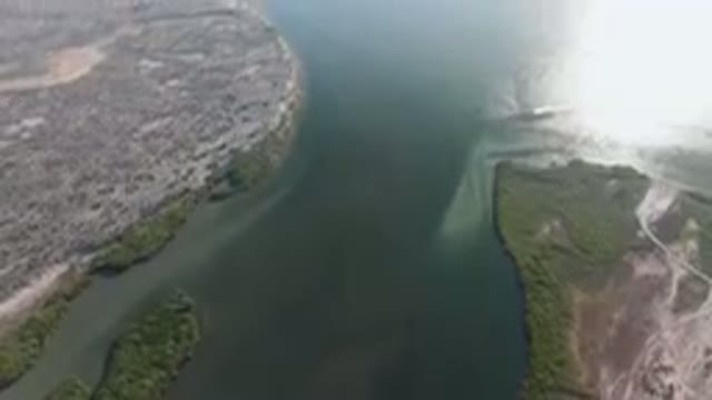 ALDOFO LOPEZ MATEOS BCS MEXICO-2023: Aerial River With A Boat In The Middle Of