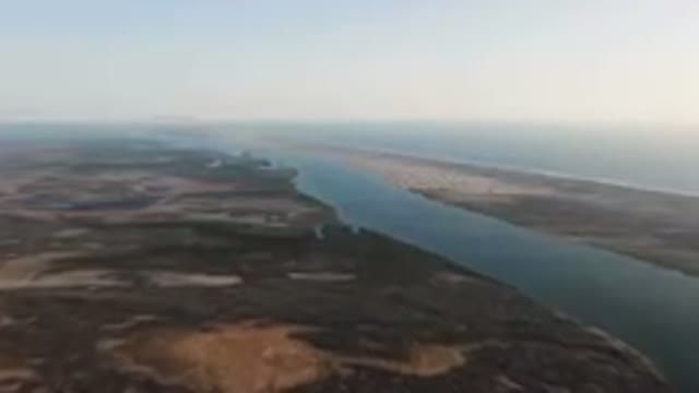 ALDOFO LOPEZ MATEOS BCS MEXICO-2023: Aerial River Running Through A Desert Area