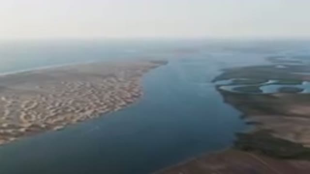 ALDOFO LOPEZ MATEOS BCS MEXICO-2023: Wide Body Of Water With A Beach And Sand