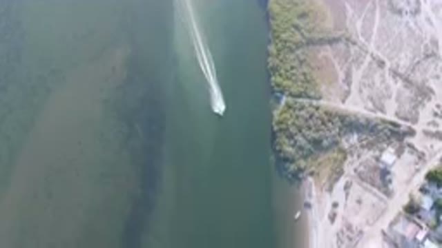 ALDOFO LOPEZ MATEOS BCS MEXICO-2023: Aerial Boat Traveling Down A River Next To