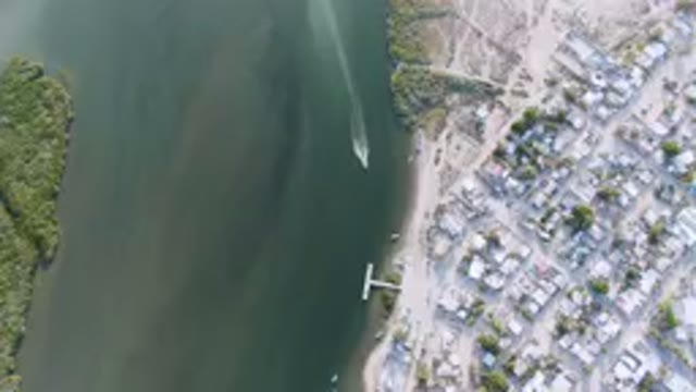 ALDOFO LOPEZ MATEOS BCS MEXICO-2023: Aerial View of Small Town With Boat in Water