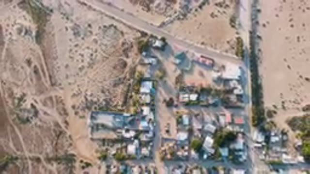 ALDOFO LOPEZ MATEOS BCS MEXICO-2023: Aerial View of Small Town With River Running