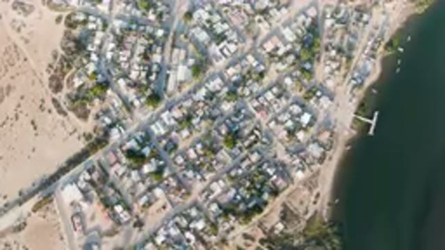 ALDOFO LOPEZ MATEOS BCS MEXICO-2023: Aerial City With A River And A Bridge