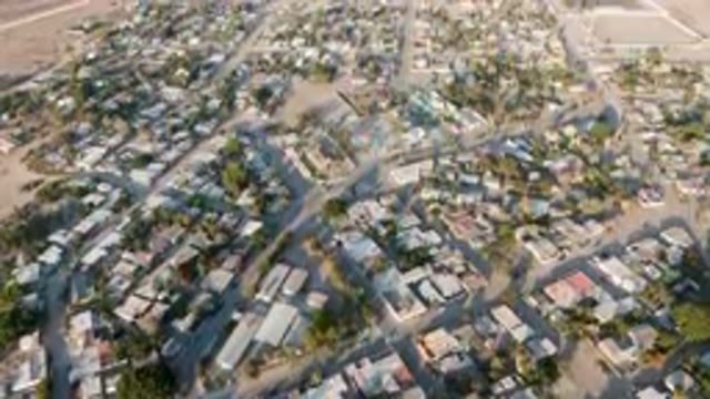 ALDOFO LOPEZ MATEOS BCS MEXICO-2023: Aerial View of Flooded City With Houses and Trees