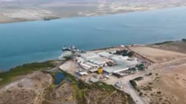 Comondu, BCS MEXICO-July 7, 2023- Aerial Large Factory Along A River