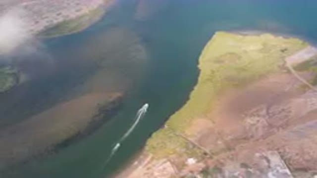 ALDOFO LOPEZ MATEOS BCS MEXICO-2023: Aerial Boat Traveling Down A River In The