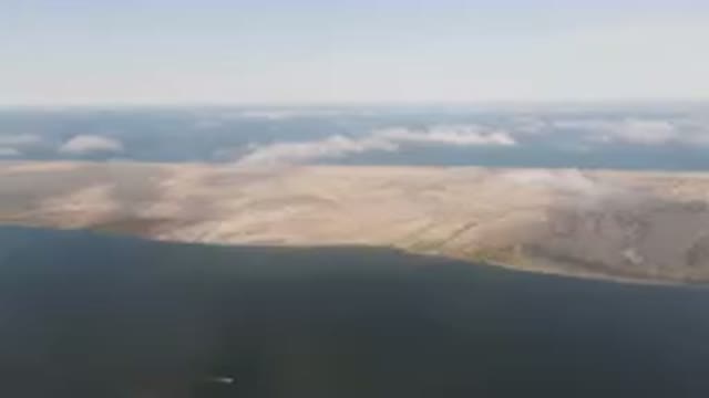 ALDOFO LOPEZ MATEOS BCS MEXICO-2023: Large Body Of Water With A Small Island In