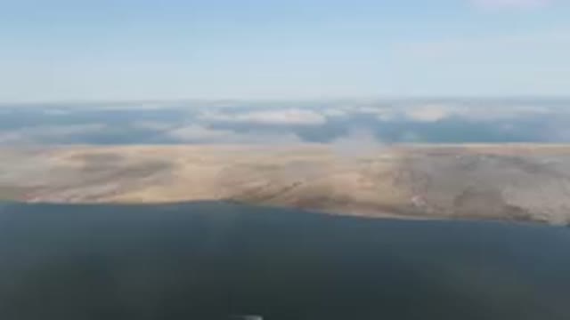 ALDOFO LOPEZ MATEOS BCS MEXICO-2023: Lake And A Mountain With A Boat In It