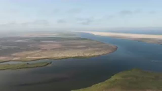 ALDOFO LOPEZ MATEOS BCS MEXICO-2023: Large Body Of Water With A Plane Flying