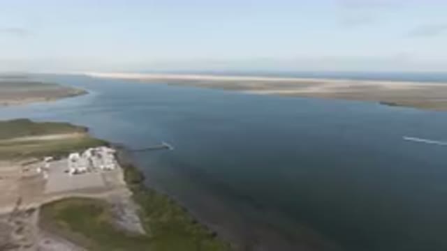 ALDOFO LOPEZ MATEOS BCS MEXICO-2023: Aerial Wide Shot of Large Body of Water With a Boat