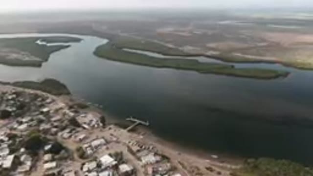 ALDOFO LOPEZ MATEOS BCS MEXICO-2023: Aerial River And City With A Boat In The