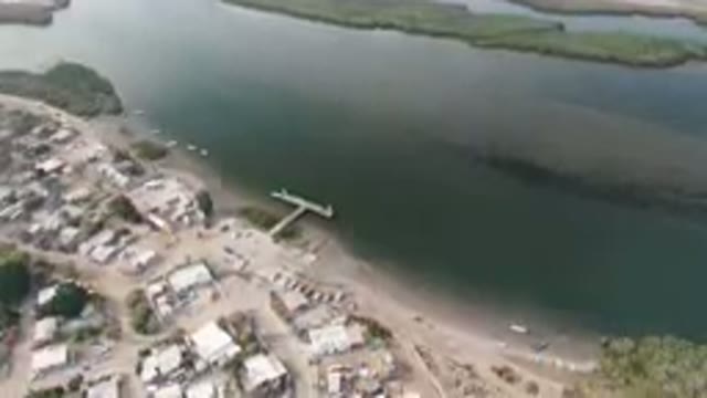 ALDOFO LOPEZ MATEOS BCS MEXICO-2023: Aerial Small Town With A Dock And A Body Of Water