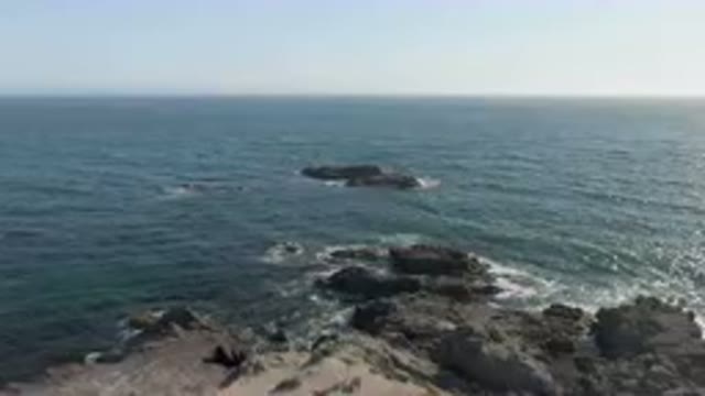 BAHIA ASCUNCION BCS MEXICO-2023: Large Body Of Water With Rocks In The Middle