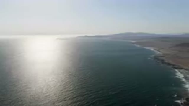 BAHIA ASCUNCION BCS MEXICO-2023: Beach And A Body Of Water With Mountains In The Background