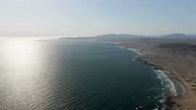 BAHIA ASCUNCION BCS MEXICO-2023: Beach And A Body Of Water With Mountains In The Background
