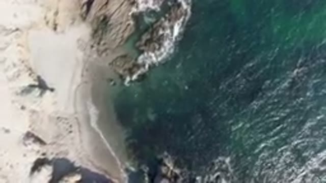 BAHIA ASCUNCION BCS MEXICO-2023: Aerial Beach With A Body Of Water And A Rocky Shoreline