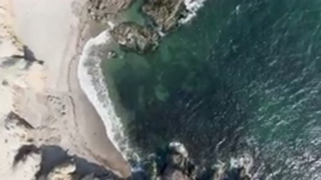 BAHIA ASCUNCION BCS MEXICO-2023: Aerial Beach With A Body Of Water And A Rocky Shoreline
