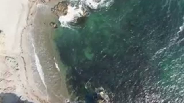 BAHIA ASCUNCION BCS MEXICO-2023: Aerial Beach With A Body Of Water And A Rock
