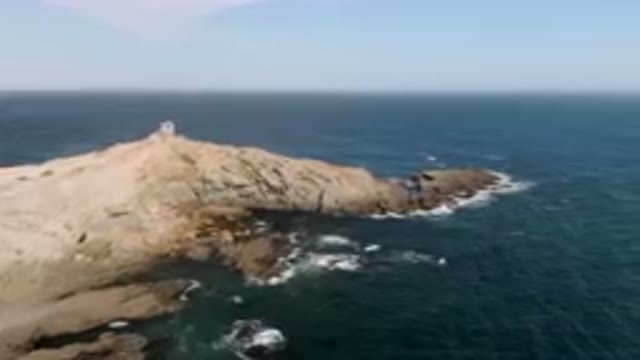 BAHIA ASCUNCION BCS MEXICO-2023: Lighthouse On A Rocky Cliff Overlooking The Ocean