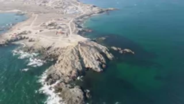 BAHIA ASCUNCION BCS MEXICO-2023: Aerial Rocky Coastline With A Small Town In The
