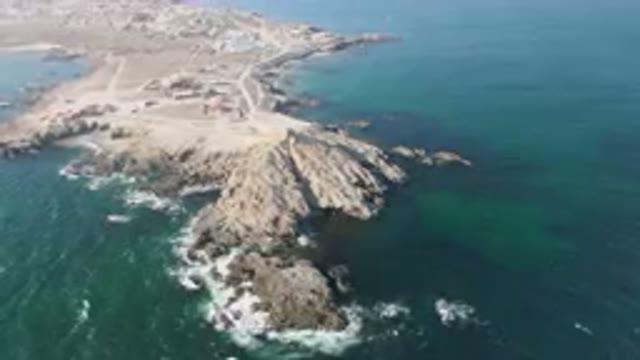 BAHIA ASCUNCION BCS MEXICO-2023: Aerial Rocky Island With A Beach And A Town In