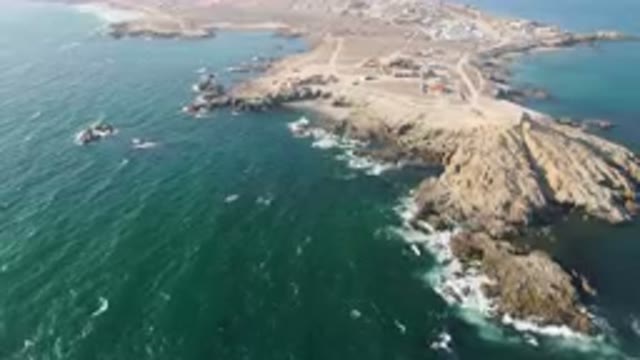BAHIA ASCUNCION BCS MEXICO-2023: Aerial Rocky Coastline With A Small Town On The