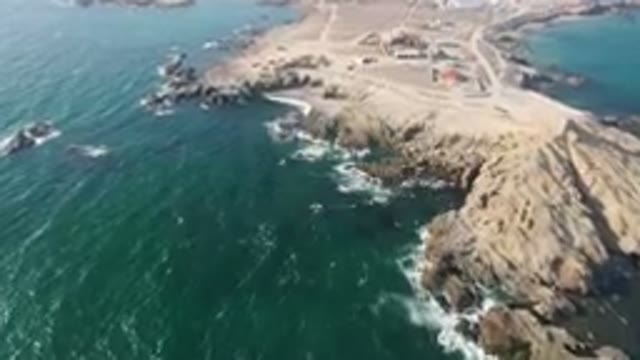 BAHIA ASCUNCION BCS MEXICO-2023: Aerial Rocky Coastline With A Small Town On The