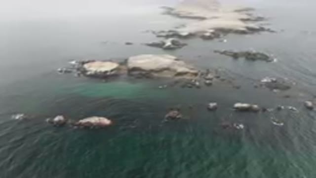 BAHIA ASCUNCION BCS MEXICO-2023: Rocky Coastline With A Small Island In The Distance