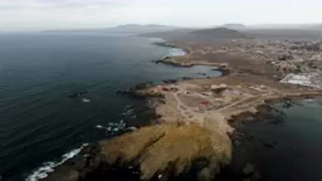 BAHIA ASCUNCION BCS MEXICO-2023: Aerial View of Small Town on Rocky Coast with Ocean