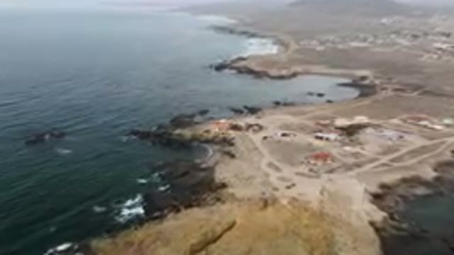 BAHIA ASCUNCION BCS MEXICO-2023: Aerial View of Small Town on Rocky Coast with Ocean