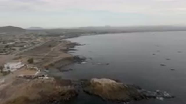 BAHIA ASCUNCION BCS MEXICO-2023: Many Boats in the Water Near a Rocky Shore