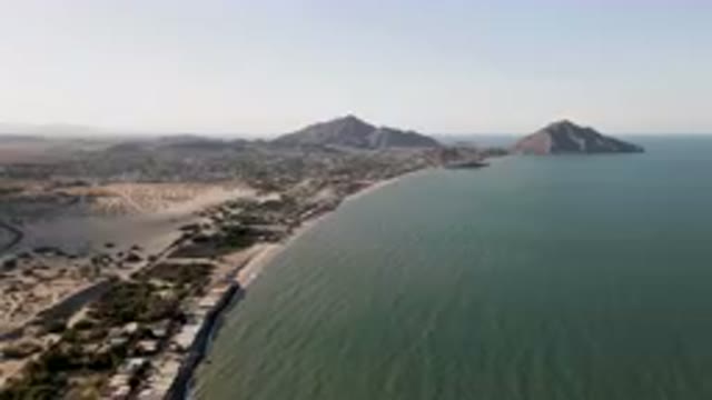 SAN FELIPE BC MEXICO-2023: Beach And A Body Of Water With A Mountain In The